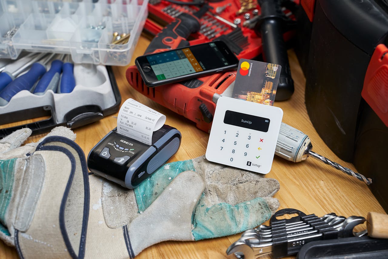 A card reader setup with tools indicates a small business transaction scene.